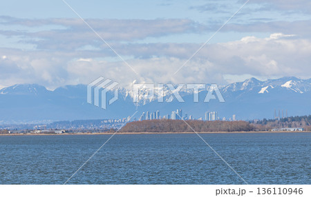 Beautiful landscape view of the sea and Richmond city in British Columbia and beautiful mountains Beautiful landscape view of the sea and Richmond city in British Columbia and beautiful mountains 136110946