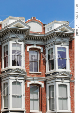 Old Victorian style exterior design windows of the house in old city. 136110956