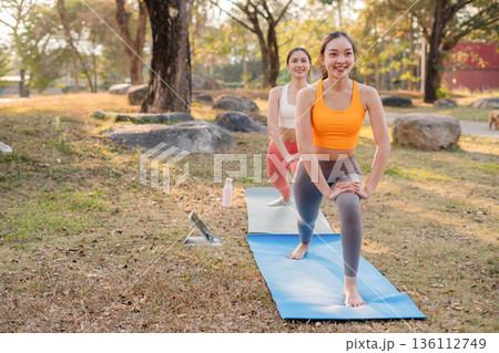 Fit woman practicing yoga outdoor. Calmness and relax. fitness, yoga training, lifestyle. 136112749