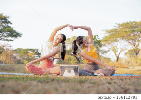 Fit woman practicing yoga outdoor. Calmness and relax. fitness, yoga training, lifestyle. 136112793