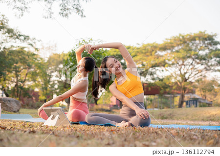 Fit woman practicing yoga outdoor. Calmness and relax. fitness, yoga training, lifestyle. 136112794