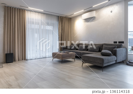 Spacious modern living room with sectional sofa and terrace access Spacious modern living room with sectional sofa and terrace access 136114318