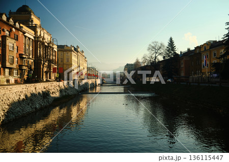 Riverside Canal in Urban Neighborhood 136115447