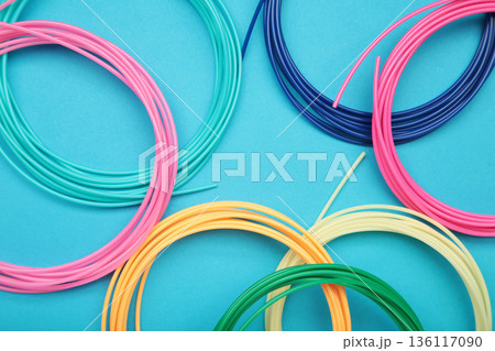 3d pen for creating volume plastic figures on blue background. 136117090