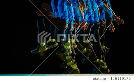 Runner airborne phase stroboscopic on black background. 136119170