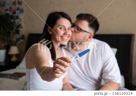 Happy Couple Celebrating Positive Pregnancy Test Happy Couple Celebrating Positive Pregnancy Test 136120314