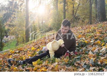 Father and baby enjoying autumn outdoors Father and baby enjoying autumn outdoors 136120327