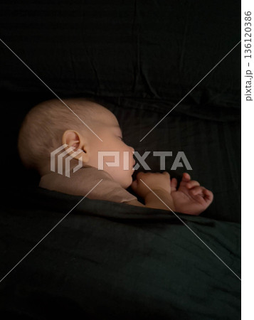 Peaceful Baby Sleeping Under Blanket 136120386