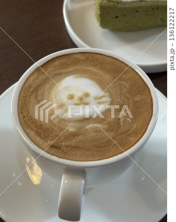 A beautifully crafted latte, featuring creamy foam art on top of rich espresso. Perfect for coffee-related projects, this image captures the warmth and inviting nature of a classic café experience. 136122217