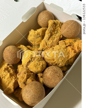 Crispy Korean fried chicken, perfectly glazed with a sweet and spicy sauce. Ideal for food photography and menus, showcasing the irresistible crunch and flavor of this beloved dish. Crispy Korean fried chicken, perfectly glazed with a sweet and spicy sauce. Ideal for food photography and menus, showcasing the irresistible crunch and flavor of this beloved dish. 136122533