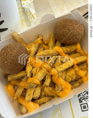 Crispy Korean fried chicken, perfectly glazed with a sweet and spicy sauce. Ideal for food photography and menus, showcasing the irresistible crunch and flavor of this beloved dish. Crispy Korean fried chicken, perfectly glazed with a sweet and spicy sauce. Ideal for food photography and menus, showcasing the irresistible crunch and flavor of this beloved dish. 136122691