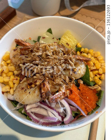 A vibrant poke bowl filled with fresh diced fish, vegetables, and flavorful toppings. Perfect for food photography, this dish embodies the essence of healthy, colorful eating and Hawaiian-inspired. A vibrant poke bowl filled with fresh diced fish, vegetables, and flavorful toppings. Perfect for food photography, this dish embodies the essence of healthy, colorful eating and Hawaiian-inspired. 136122693