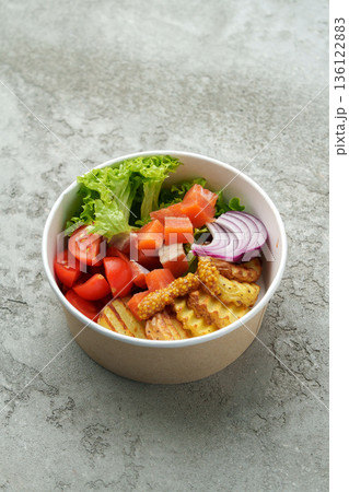 Healthy salad bowl with fresh vegetables and crispy chips served for lunch 136122883