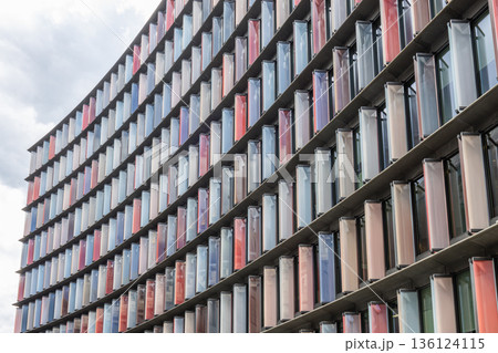 Modern building facade with colorful vertical panels Modern building facade with colorful vertical panels 136124115