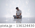 Sad man sitting under falling magical light rain. AI-generated item 136124430