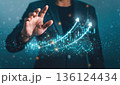 Businessman touching digital growth graph on virtual screen. AI-generated item 136124434