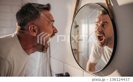 Angry man screaming at his reflection in mirror. AI-generated item 136124437