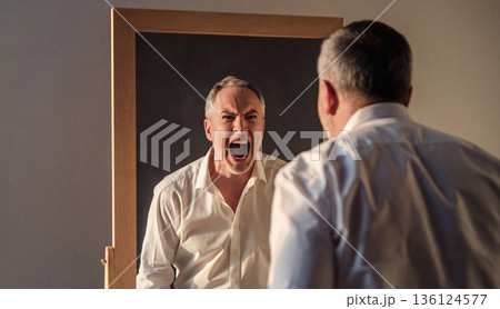 Angry man screaming at his reflection in mirror. AI-generated item 136124577