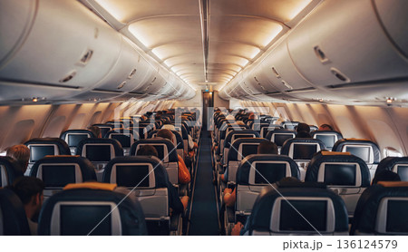 Modern commercial airplane cabin interior with passengers. AI-generated item 136124579