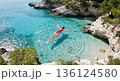 Aerial top view of woman floating in clear blue sea. AI-generated item 136124580