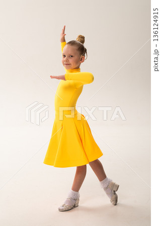 Close-up portrait of child with cochlear implant during dance practice. Hearing loss treatment, auditory rehabilitation, assistive medical technology, emotional adaptation, and inclusive healthcare Close-up portrait of child with cochlear implant during dance practice. Hearing loss treatment, auditory rehabilitation, assistive medical technology, emotional adaptation, and inclusive healthcare 136124915