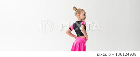 Portrait of child with cochlear implant during dance practice in studio. Banner with copy space. Hearing loss treatment, auditory rehabilitation, assistive medical device, emotional adaptation, and 136124939
