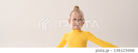 Banner child with cochlear implant during sport dance practice in studio. Copy space. Hearing loss treatment, auditory rehabilitation, assistive technology, body coordination, and inclusive physical Banner child with cochlear implant during sport dance practice in studio. Copy space. Hearing loss treatment, auditory rehabilitation, assistive technology, body coordination, and inclusive physical 136125006