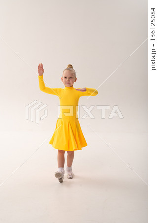 Young dancer with cochlear implant performing expressive movement in studio. Hearing loss rehabilitation, auditory training, assistive medical technology, inclusive sport dance, and physical 136125084