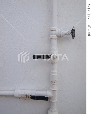 copper pipes and stopcocks painted white copper pipes and stopcocks painted white 136125125