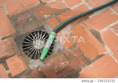 drain hose and sump with ice from the cold at night 136125232