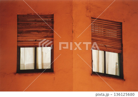 windows with wooden shutters and light inside windows with wooden shutters and light inside 136125680
