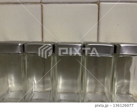 empty glass jars with stainless steel lid on old ceramic 136126077