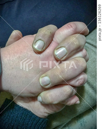 hands of a couple intertwining as a sign of love hands of a couple intertwining as a sign of love 136126269