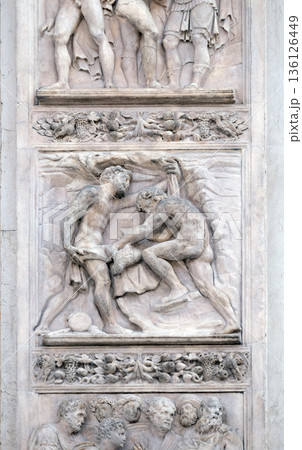 The brothers tinged Joseph's coat with the blood by Giacomo Raibolini, right door of San Petronio Basilica in Bologna, Italy 136126449