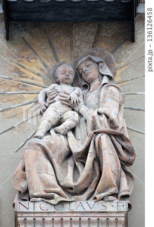 Virgin Mary with baby Jesus statue on house facade in Bologna, Italy Virgin Mary with baby Jesus statue on house facade in Bologna, Italy 136126458