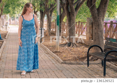 Woman sits on the bench in Alanya city 136126521