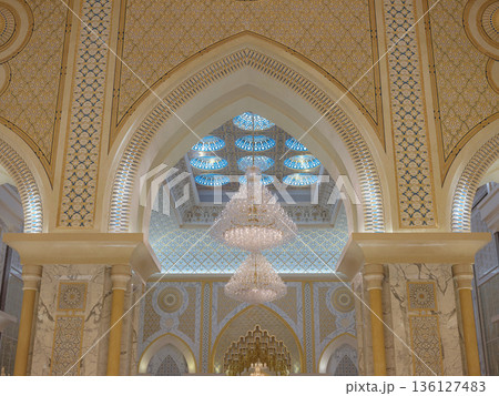 Abu Dhabi, UAE January 15, 2024 Breathtaking interior of Palace features massive golden dome and intricate mosaics. decorations royal opulence inside presidential palace of United Arab Emirates. 136127483