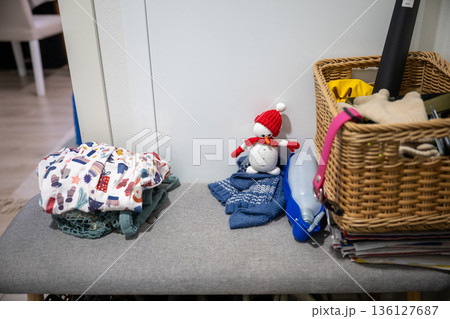 Cozy entryway bench with winter accessories, basket and handmade snowman decor 136127687