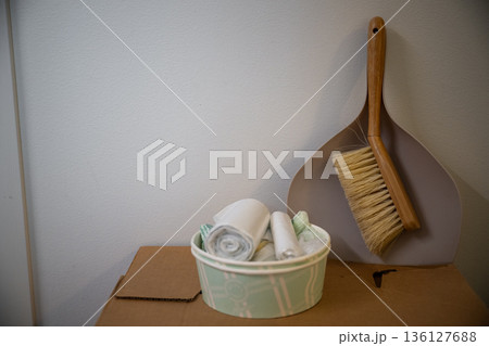 Minimal home still life with cleaning brush dustpan and reusable cloths on cardboard storage box Minimal home still life with cleaning brush dustpan and reusable cloths on cardboard storage box 136127688