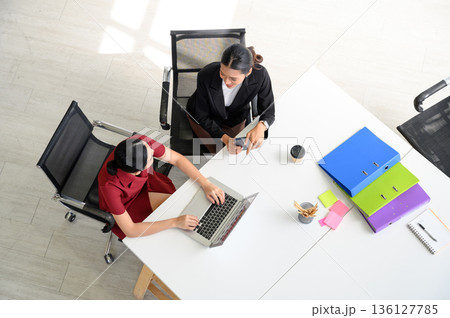 Top view of Business people working together with laptop computers on the desk in the office. 136127785