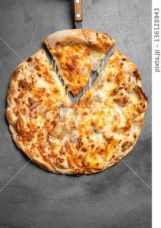 Cheese pizza with melted cheese 136128943