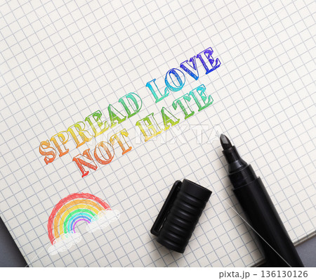 Spread Love Not Hate text with rainbow, pen, paper, and black marker Spread Love Not Hate text with rainbow, pen, paper, and black marker 136130126