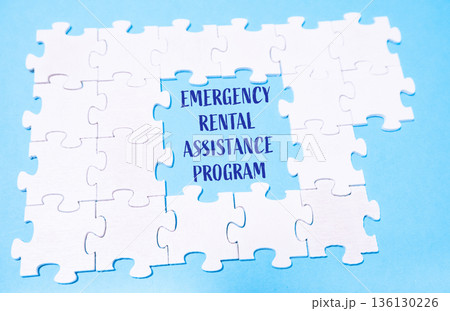 Puzzle with the words Emergency Rental Assistance Program written in the middle. 136130226