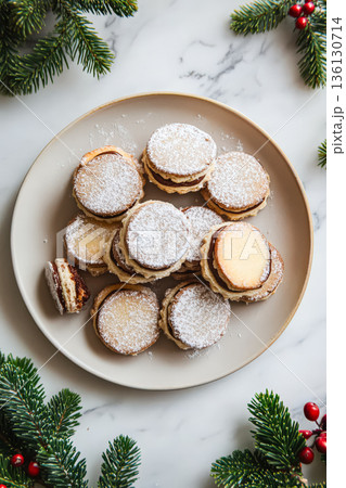 Plate of cookies with powdered sugar on top 136130714