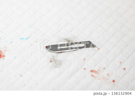Close inspection of scalpel and blood patterns for laboratory and forensic investigation Close inspection of scalpel and blood patterns for laboratory and forensic investigation 136132904