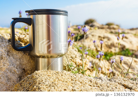 Thermal mug, thermos on nature. Travel outdoor picnic. Thermal mug, thermos on nature. Travel outdoor picnic. 136132970