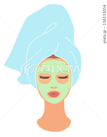 Woman with facial mask and towel 136133054