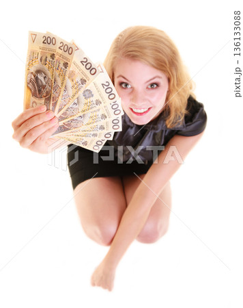 Business woman holding polish currency money banknote. 136133088