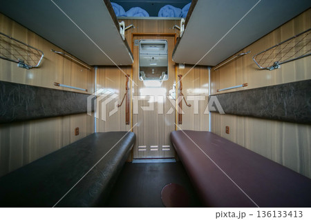Train compartment providing a cozy cabin for passengers journeying by rail Train compartment providing a cozy cabin for passengers journeying by rail 136133413