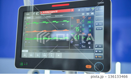 Ventilator screen displaying vital signs and medical data in hospital ICU 136133466